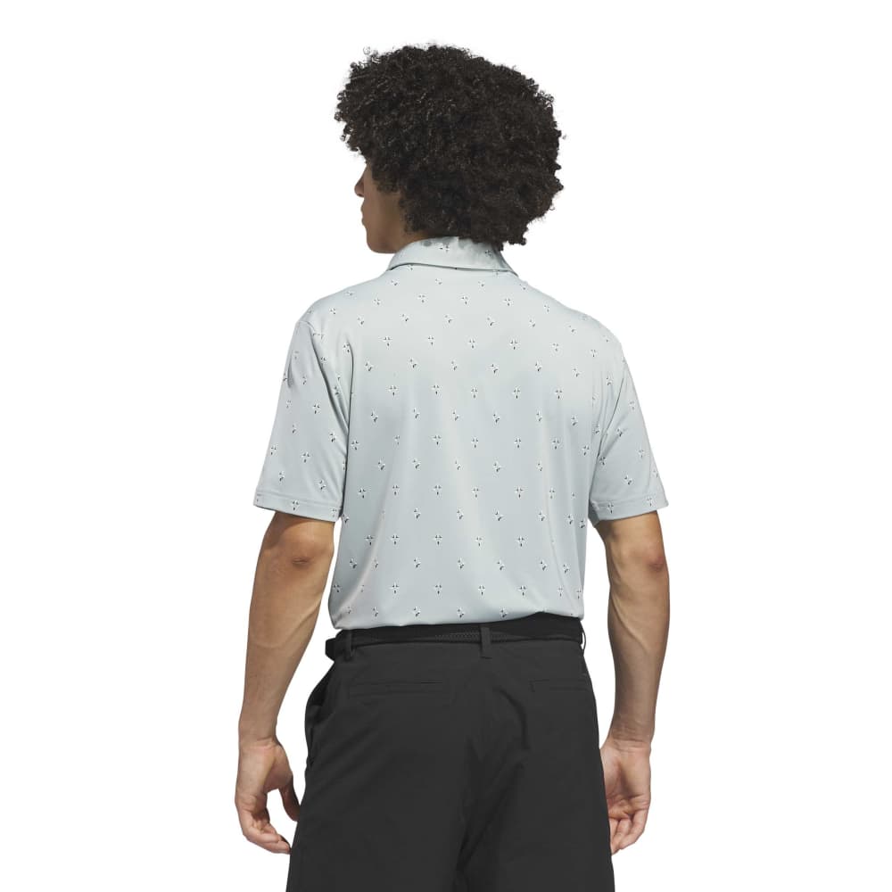 Light sage polo shirt with subtle pattern and Adidas logo on a white background