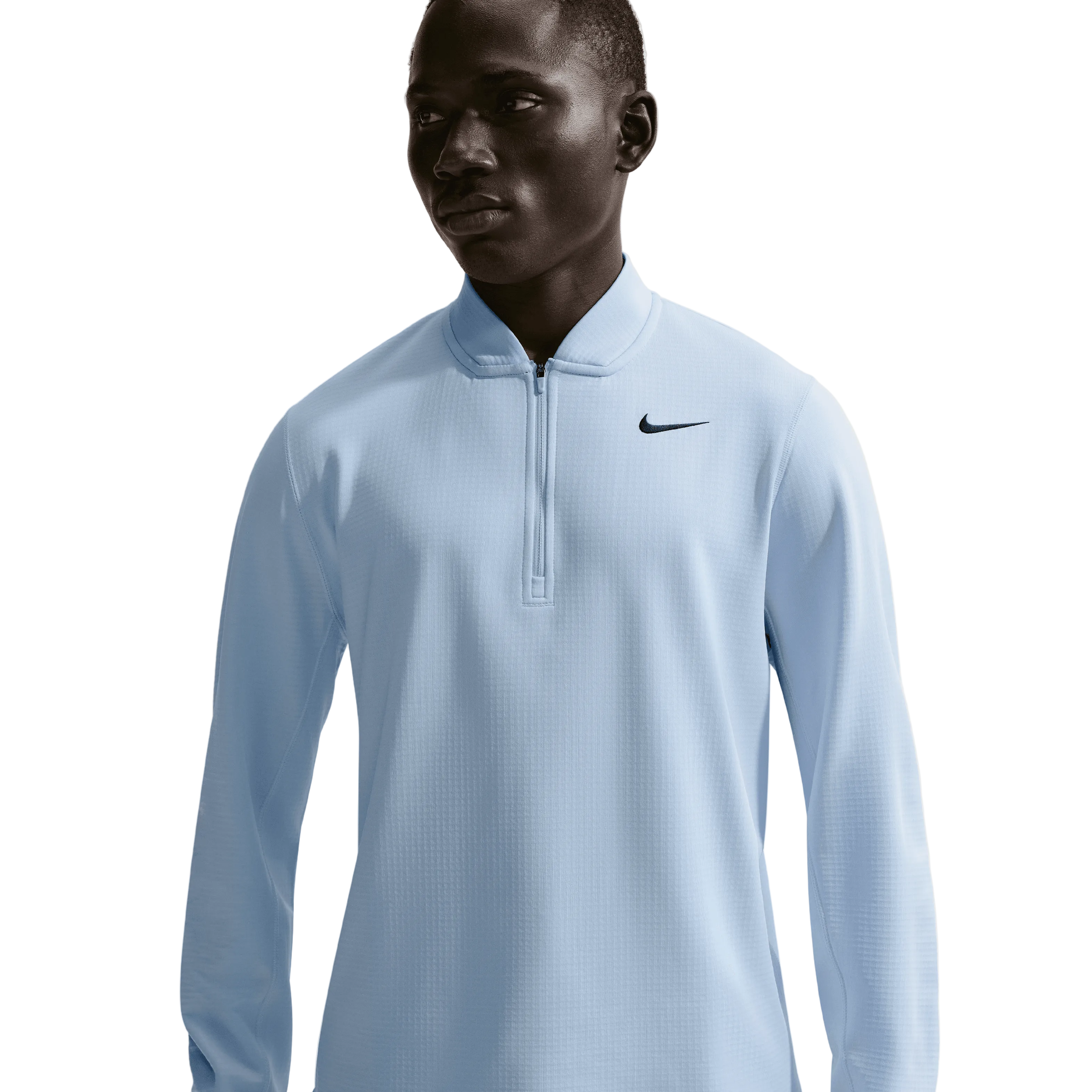 Man wearing a light blue Nike long-sleeve shirt on a white background